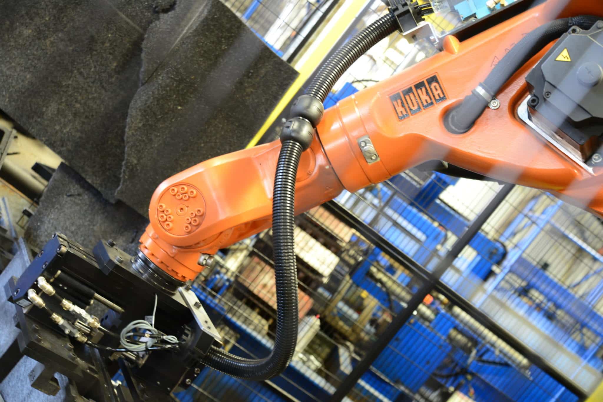 Integration of consumer products manufacturing robotics, like this one from Kuka, can help improve efficiency.